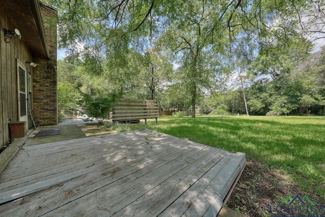 324 Highlander Hts, Hideaway, TX 75771 - deck featuring a yard and view of wooded area