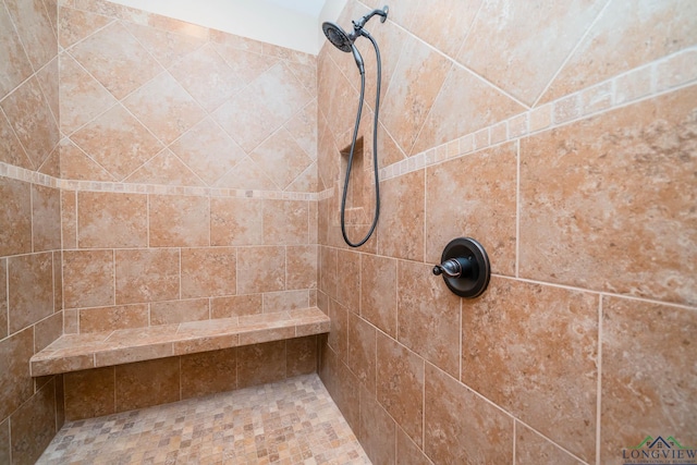 bathroom featuring tiled shower