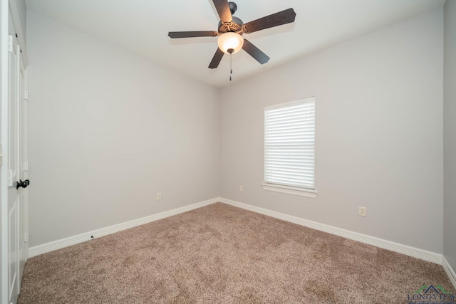 spare room with carpet flooring and ceiling fan