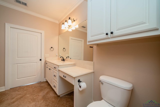 bathroom featuring crown molding, vanity, and toilet