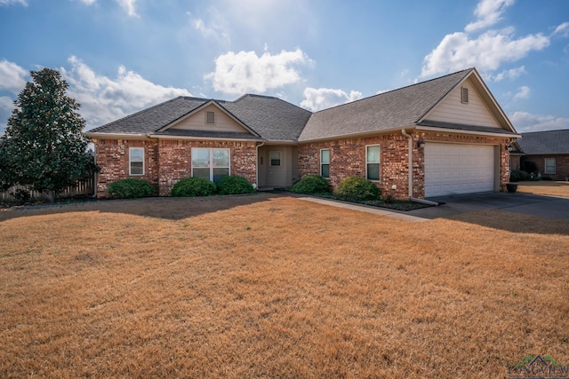 view of front of house with a garage and a front lawn