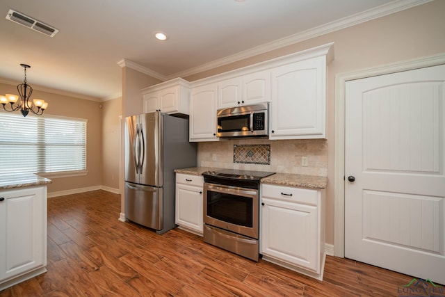 kitchen with white cabinetry, wood-type flooring, pendant lighting, stainless steel appliances, and light stone countertops