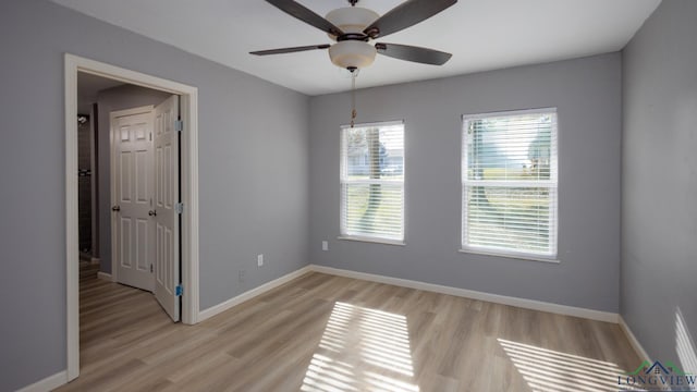 unfurnished room featuring ceiling fan and light hardwood / wood-style flooring