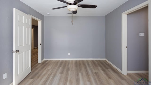 spare room with light hardwood / wood-style floors and ceiling fan