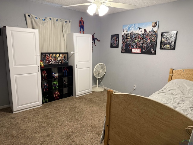1101 Rolling Hls, Longview, TX 75604 - bedroom featuring carpet, ceiling fan, and a textured ceiling