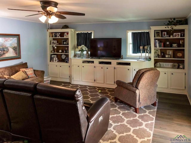 living room featuring light hardwood / wood-style floors, ceiling fan, and crown molding