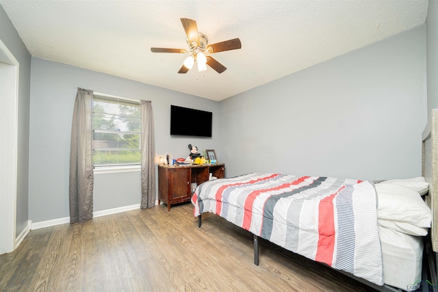 1605 Clearwood Dr, Longview, TX 75604 - bedroom featuring wood finished floors and a ceiling fan