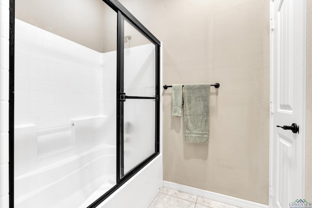 107 Lakeway Ln, Longview, TX 75604 - bathroom featuring tile patterned flooring and combined bath / shower with glass door