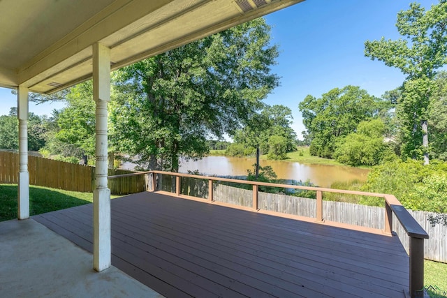107 Lakeway Ln, Longview, TX 75604 - deck with a water view, fence, and view of wooded area
