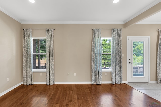 107 Lakeway Ln, Longview, TX 75604 - spare room featuring wood finished floors, ornamental molding, baseboards, and recessed lighting