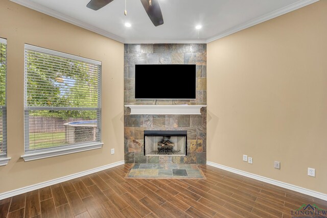 406 Alta St, Longview, TX 75604 - unfurnished living room featuring a fireplace, crown molding, baseboards, and a ceiling fan