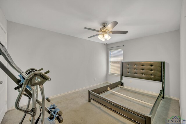 406 Alta St, Longview, TX 75604 - unfurnished bedroom featuring carpet floors, a ceiling fan, and baseboards