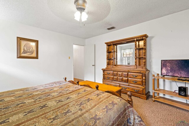 1205 Tiffany Ln, Longview, TX 75604 - bedroom with carpet, a textured ceiling, and ceiling fan