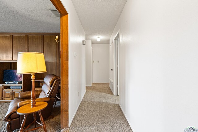 1205 Tiffany Ln, Longview, TX 75604 - hall featuring light colored carpet and a textured ceiling