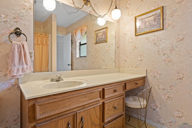 1205 Tiffany Ln, Longview, TX 75604 - bathroom with vanity and wallpapered walls