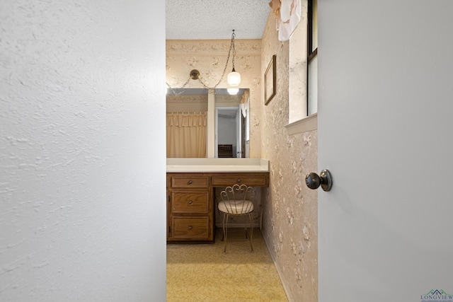 1205 Tiffany Ln, Longview, TX 75604 - bathroom featuring a textured wall and vanity