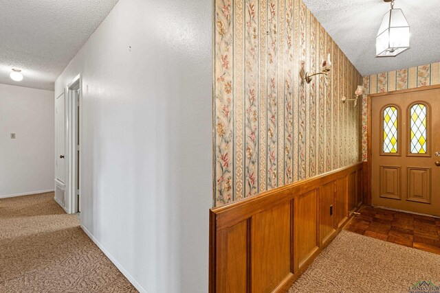 1205 Tiffany Ln, Longview, TX 75604 - foyer with a textured ceiling, wallpapered walls, and wainscoting