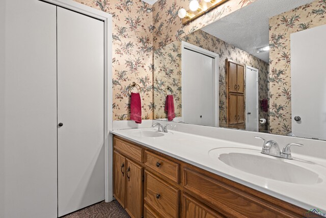 1205 Tiffany Ln, Longview, TX 75604 - bathroom with wallpapered walls and double vanity