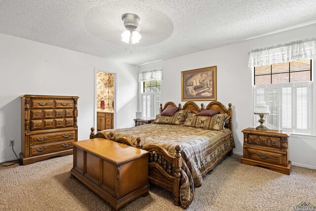 1205 Tiffany Ln, Longview, TX 75604 - bedroom featuring light carpet, a textured ceiling, and ceiling fan