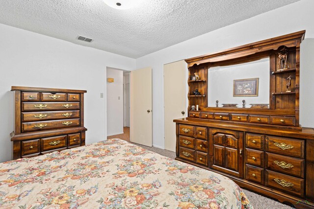 1205 Tiffany Ln, Longview, TX 75604 - bedroom with carpet floors and a textured ceiling