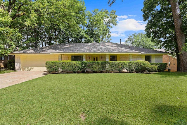 1205 Tiffany Ln, Longview, TX 75604 - single story home with a garage, brick siding, a front yard, and concrete driveway