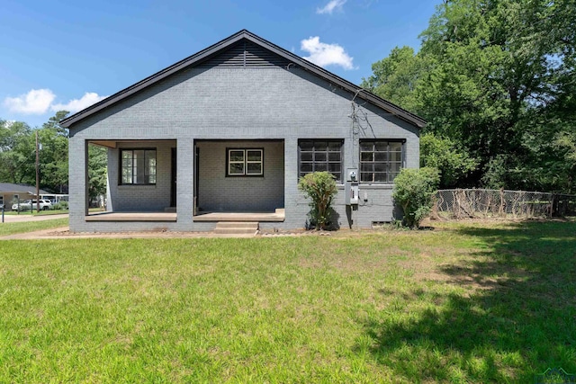 1207 Lettie St, Longview, TX 75601 - rear view of house with brick siding and a porch