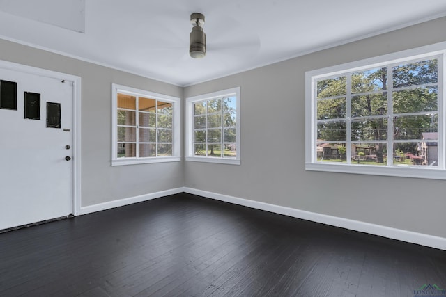 1207 Lettie St, Longview, TX 75601 - unfurnished room with baseboards, plenty of natural light, ceiling fan, dark wood-style floors, and ornamental molding