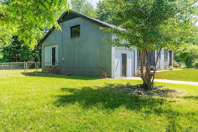 1207 Lettie St, Longview, TX 75601 - rear view of property featuring brick siding