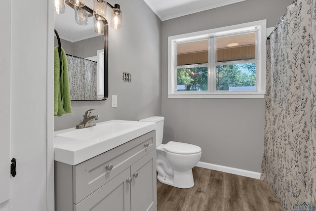 1207 Lettie St, Longview, TX 75601 - full bathroom featuring wood finished floors, vanity, toilet, crown molding, and a shower with shower curtain