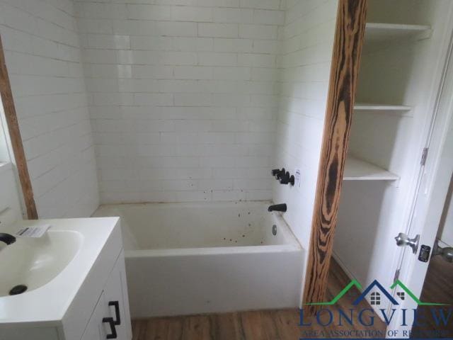 bathroom featuring hardwood / wood-style floors and vanity