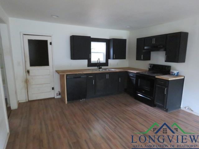 kitchen with dark wood-type flooring, sink, and black appliances