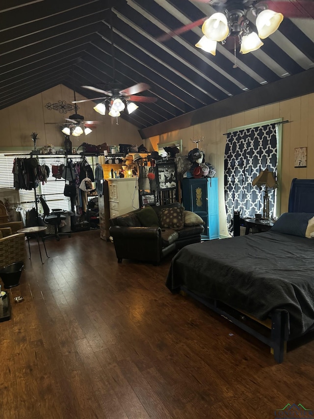 bedroom with ceiling fan, hardwood / wood-style floors, and lofted ceiling