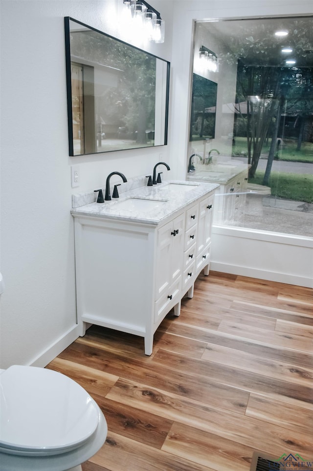 3515 Piping Rock St, Nacogdoches, TX 75965 - bathroom with double vanity and wood finished floors