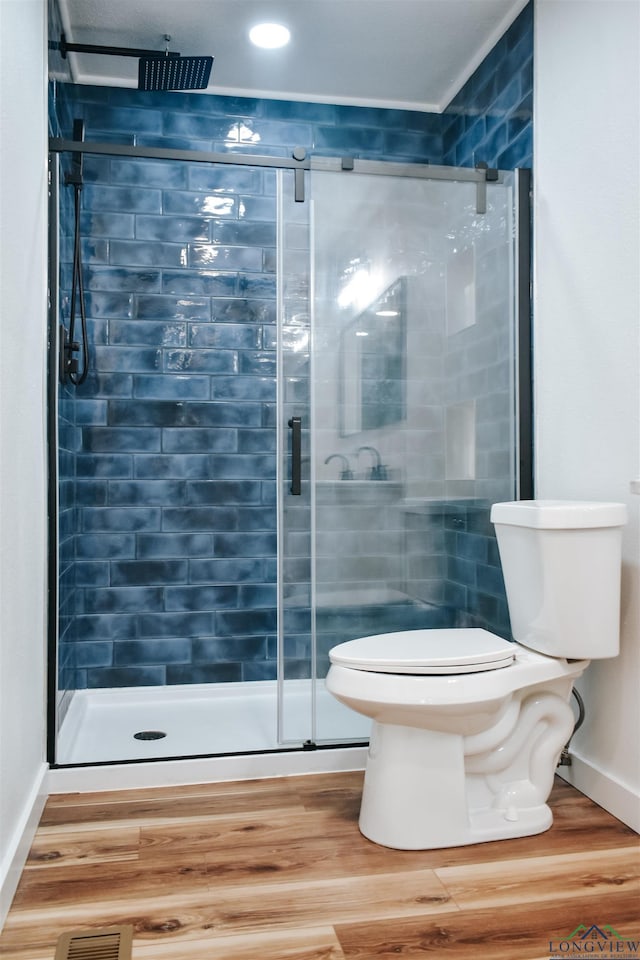 3515 Piping Rock St, Nacogdoches, TX 75965 - full bathroom with a stall shower, wood finished floors, and recessed lighting