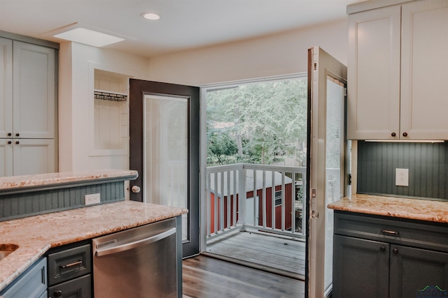 3515 Piping Rock St, Nacogdoches, TX 75965 - kitchen with dishwasher, wood finished floors, light stone counters, and recessed lighting