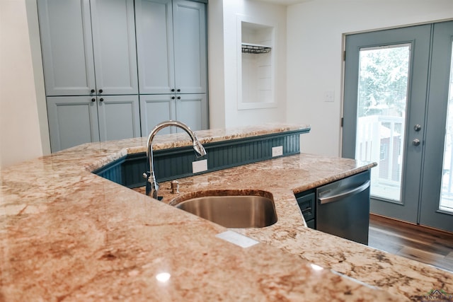 3515 Piping Rock St, Nacogdoches, TX 75965 - kitchen with dishwasher, wood finished floors, light stone countertops, and french doors