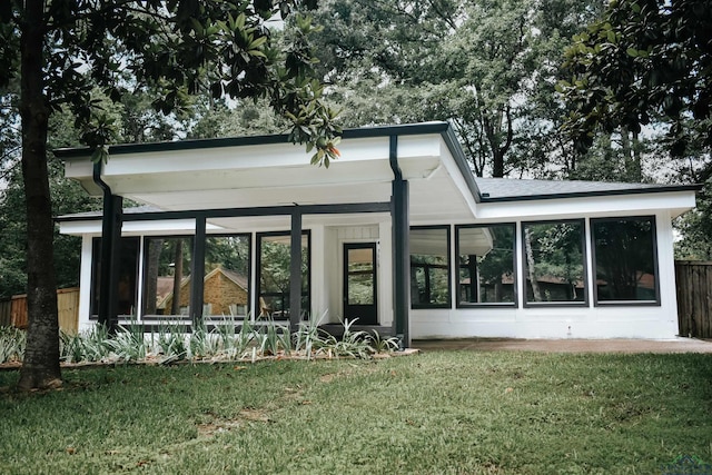 3515 Piping Rock St, Nacogdoches, TX 75965 - back of house with a sunroom