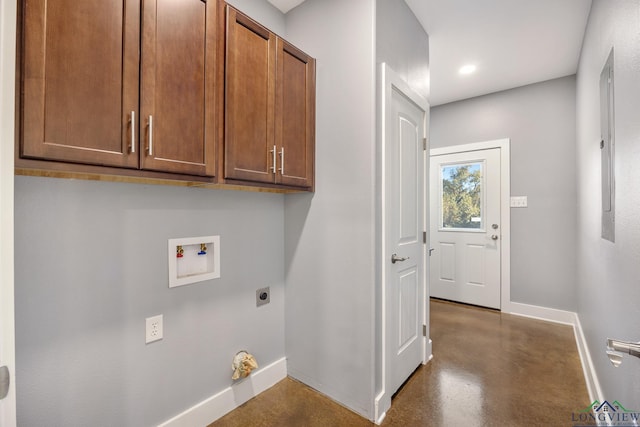 clothes washing area with hookup for an electric dryer, cabinets, and hookup for a washing machine