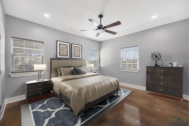 bedroom with ceiling fan and multiple windows