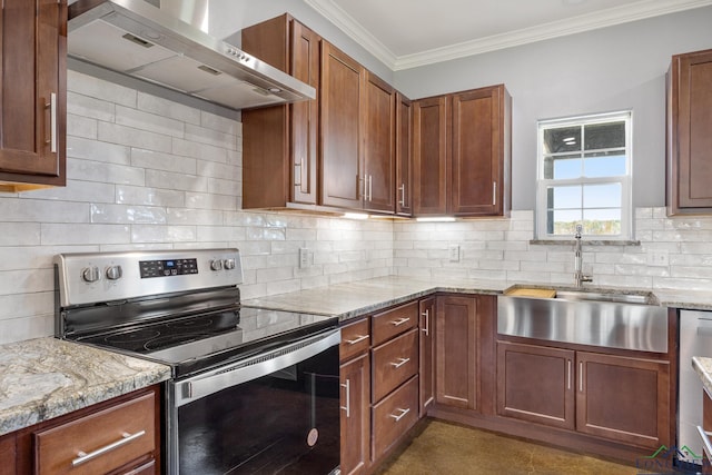 kitchen with appliances with stainless steel finishes, backsplash, light stone counters, wall chimney exhaust hood, and sink