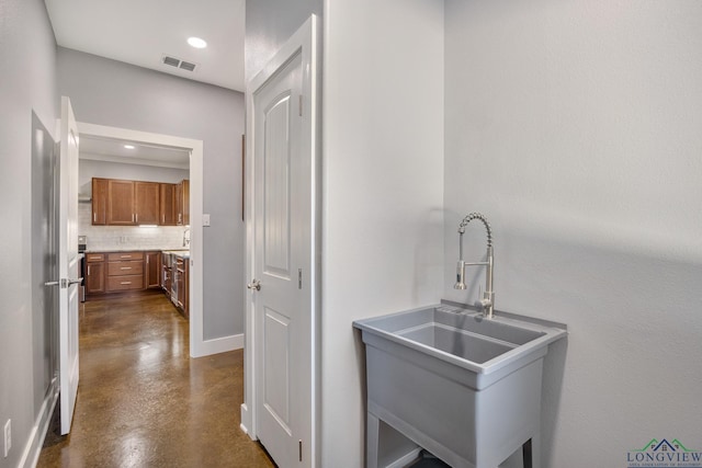 kitchen with decorative backsplash and sink