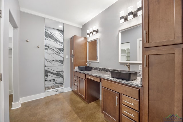 bathroom with a shower and vanity