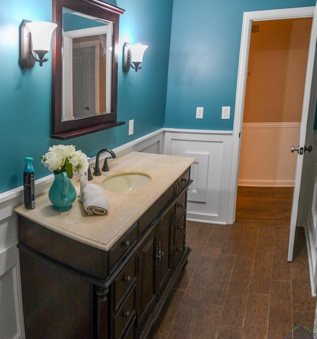 bathroom featuring vanity and wood-type flooring