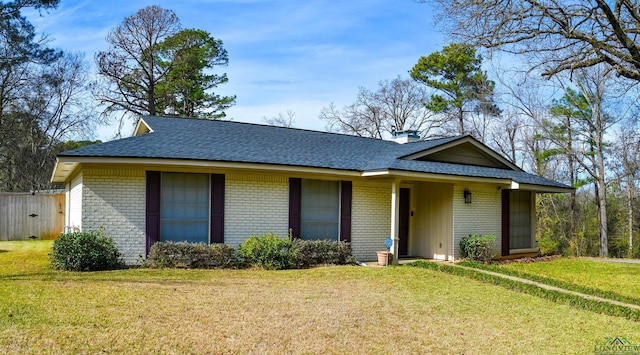 ranch-style house with a front lawn