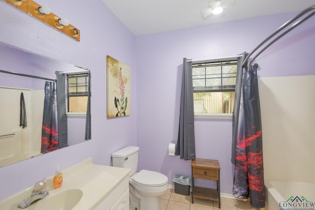 604 Kay Ct, Longview, TX 75601 - full bath with tile patterned floors, vanity, and shower / bath combo with shower curtain