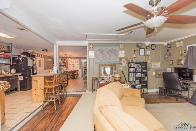 604 Kay Ct, Longview, TX 75601 - living room featuring attic access, ornamental molding, ceiling fan, a desk, and wood finished floors
