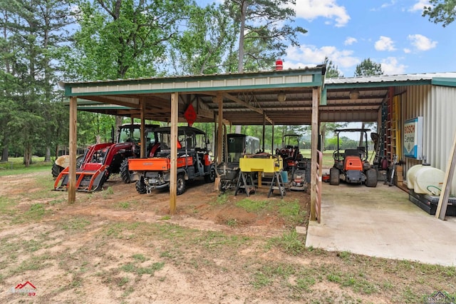 view of vehicle parking with a carport