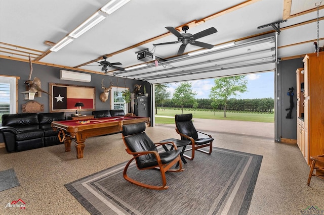 garage featuring a garage door opener, a wall mounted AC, and a ceiling fan