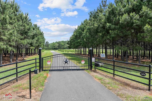 view of gate featuring fence