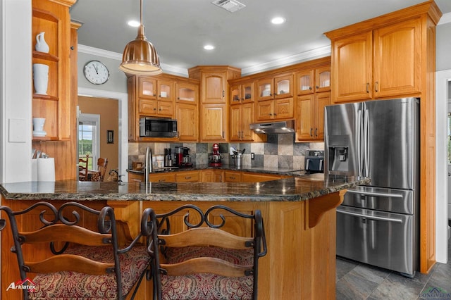 kitchen featuring decorative backsplash, visible vents, glass insert cabinets, ornamental molding, and stainless steel appliances